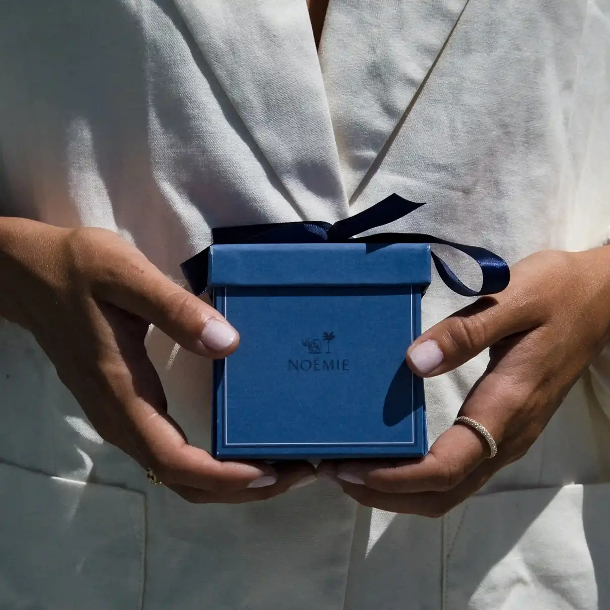 Noémie campaign still: a styled pairing across two pieces